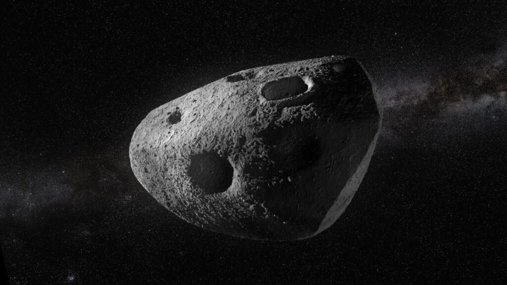 Gray, cratered asteroid floating in a starry space background